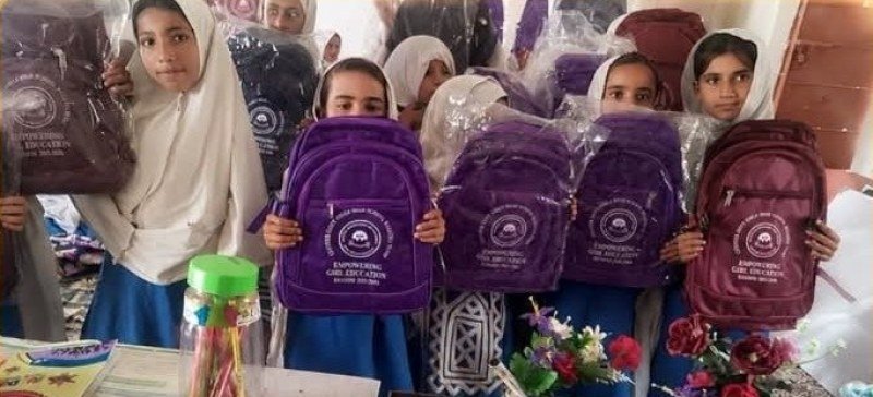 Learning materials distributed among girls at Tump primary school